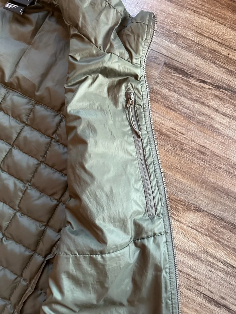 The North Face Men's Thermoball Vest in Woodland Green. Size L. *minor flaw*
